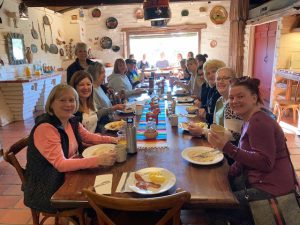 Nurses gather together to enjoy a meal at a nurse resilience retreat in Sonoma, California. 