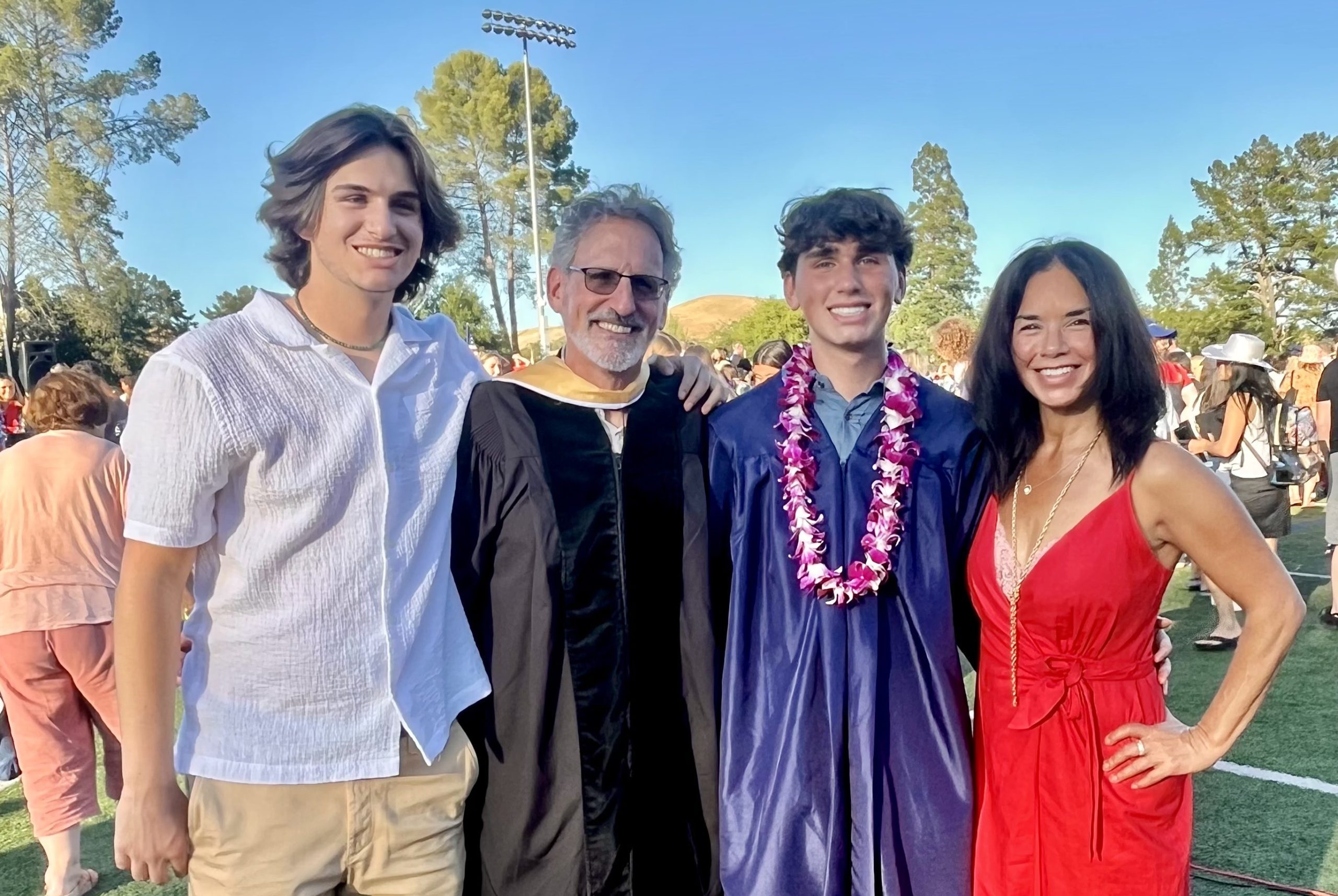 Jennifer and her family pose for a photo at her son's graduation.