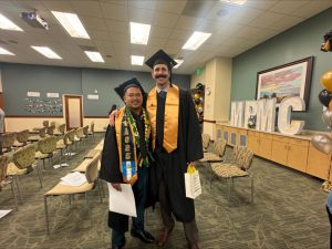Michael Lopez and Corey Aldridge share a photo following their graduation ceremony.