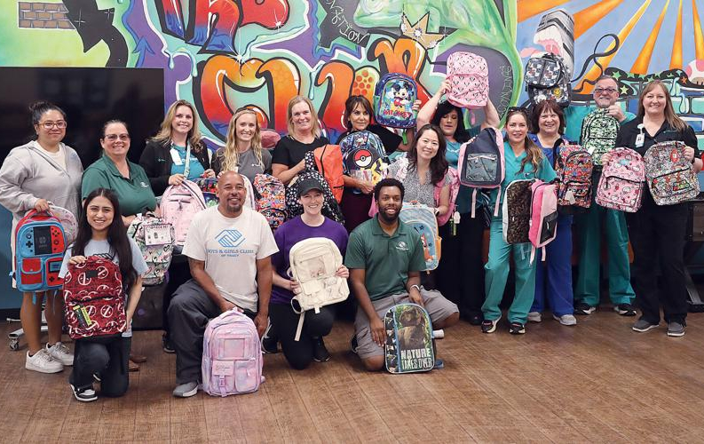 Healthcare employees with backpacks