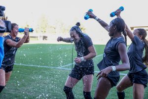 Lexi celebrates with her team following a victory at Brown University.
