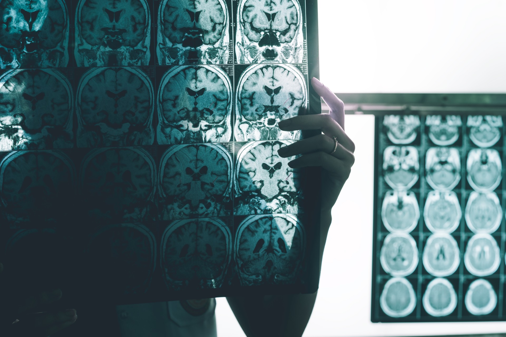 Brain mapping scan visual, someone holding a map