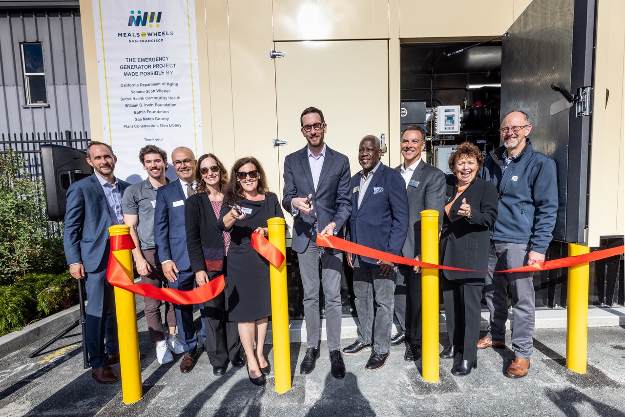 Jennifer Steele, Sen. Scott Wiener cut the ribbon on the new generator (along with board members)