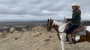 Cancer patient Marcela Tinka on a horse