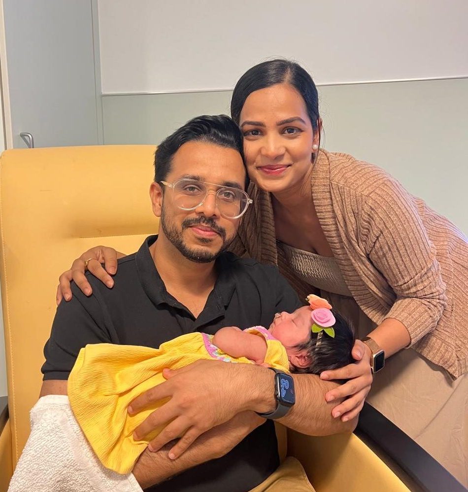 Pratik and Shweta Padney with their baby Devi An indian couple holds their newborn baby