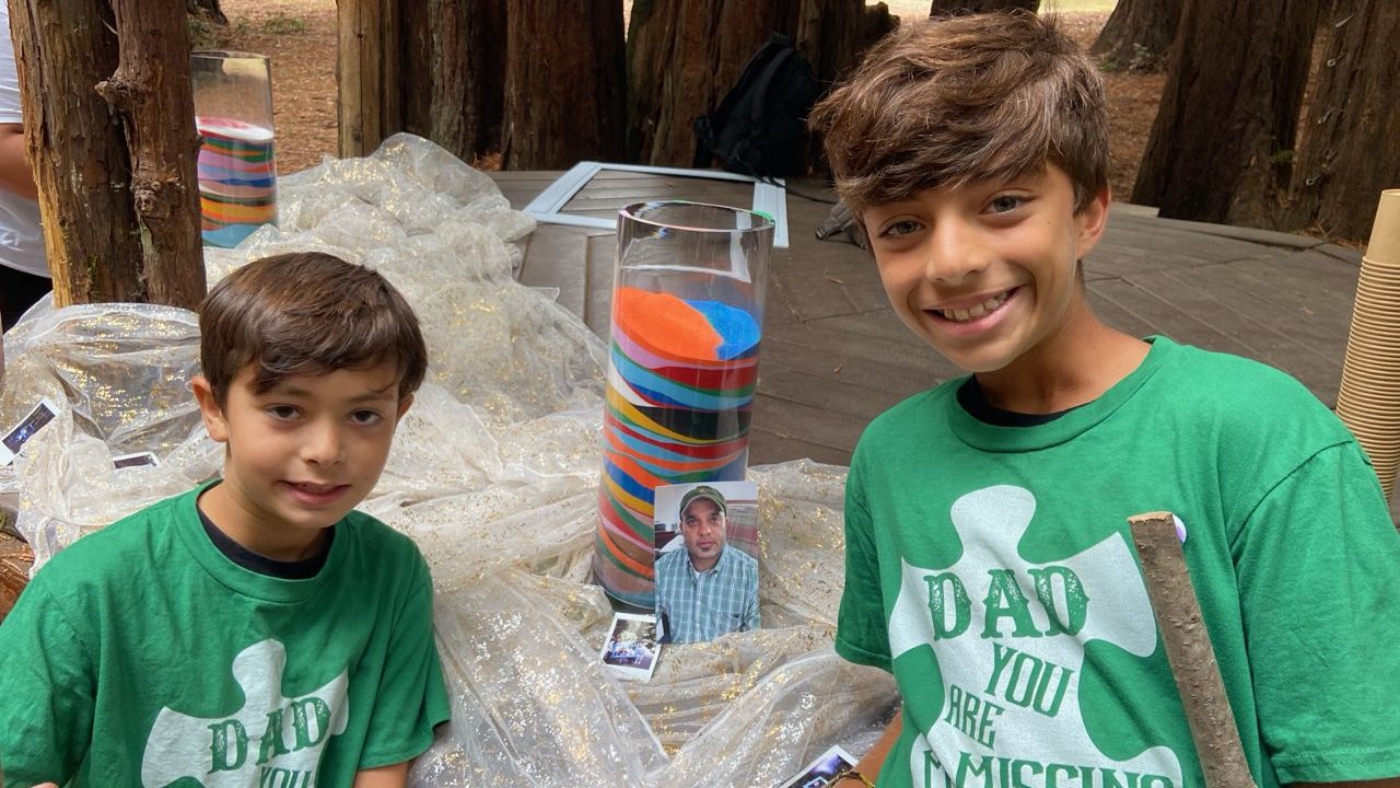 Darshan and Simran at Closing with Dad Darshan and Simran with photo of their father