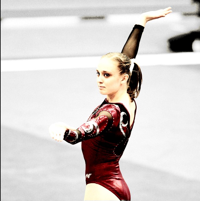 Dr. Tenaya West competes in a gymnastics competition.