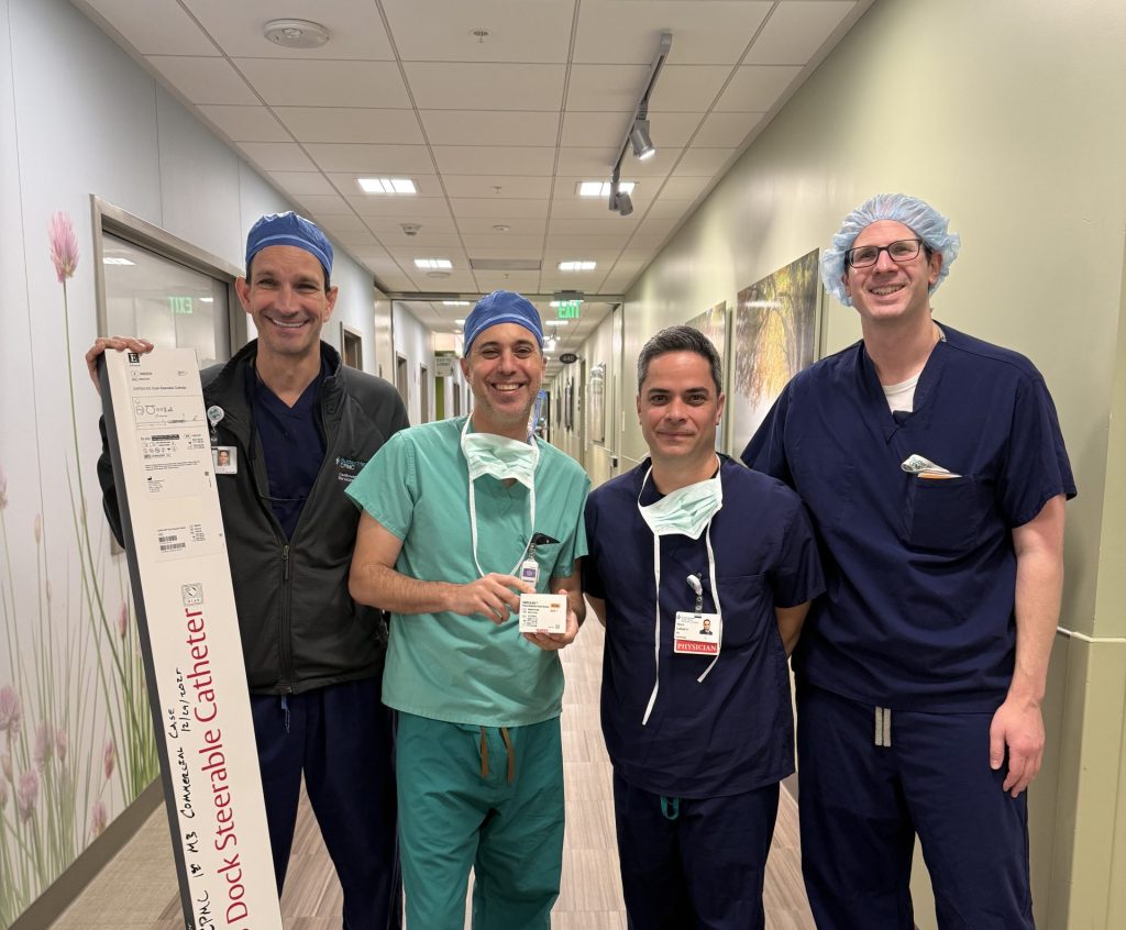 Group of surgeons stand in their scrubs after a procedure
