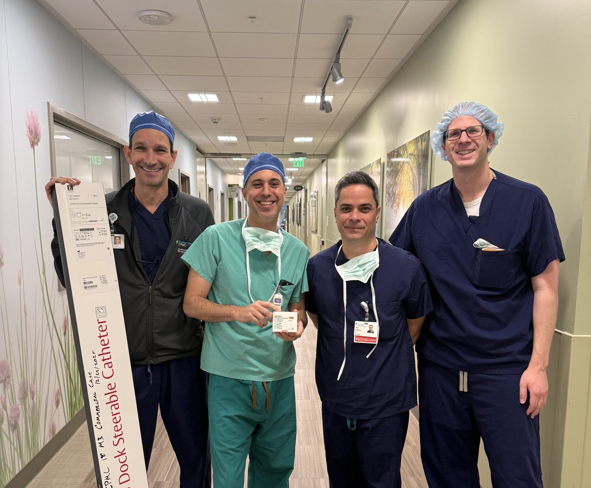 Group of surgeons stand in their scrubs after a procedure