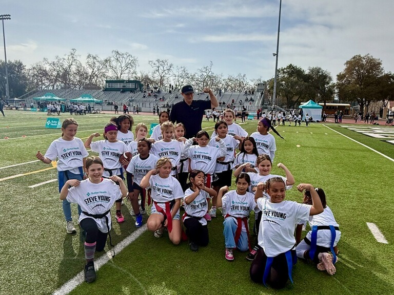 Steve Young and participants from the flag football camp.