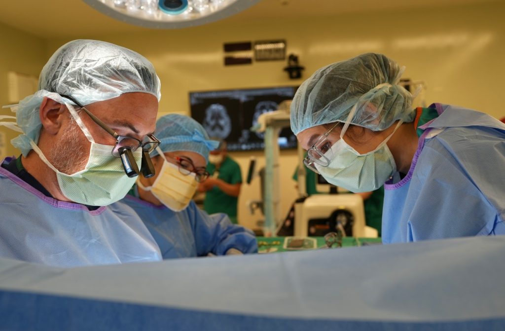 a surgeon and nurses in an OR