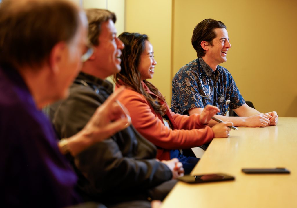 group of young male and female residents laughing