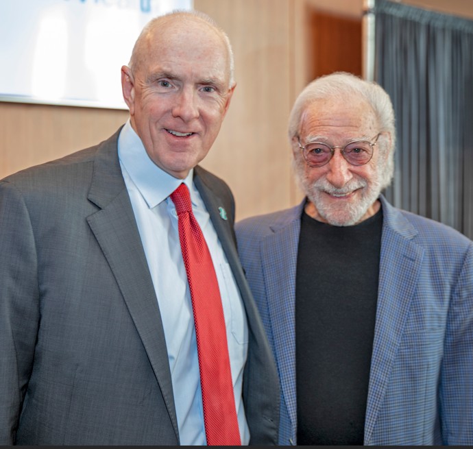 Two men in suits stand side by side