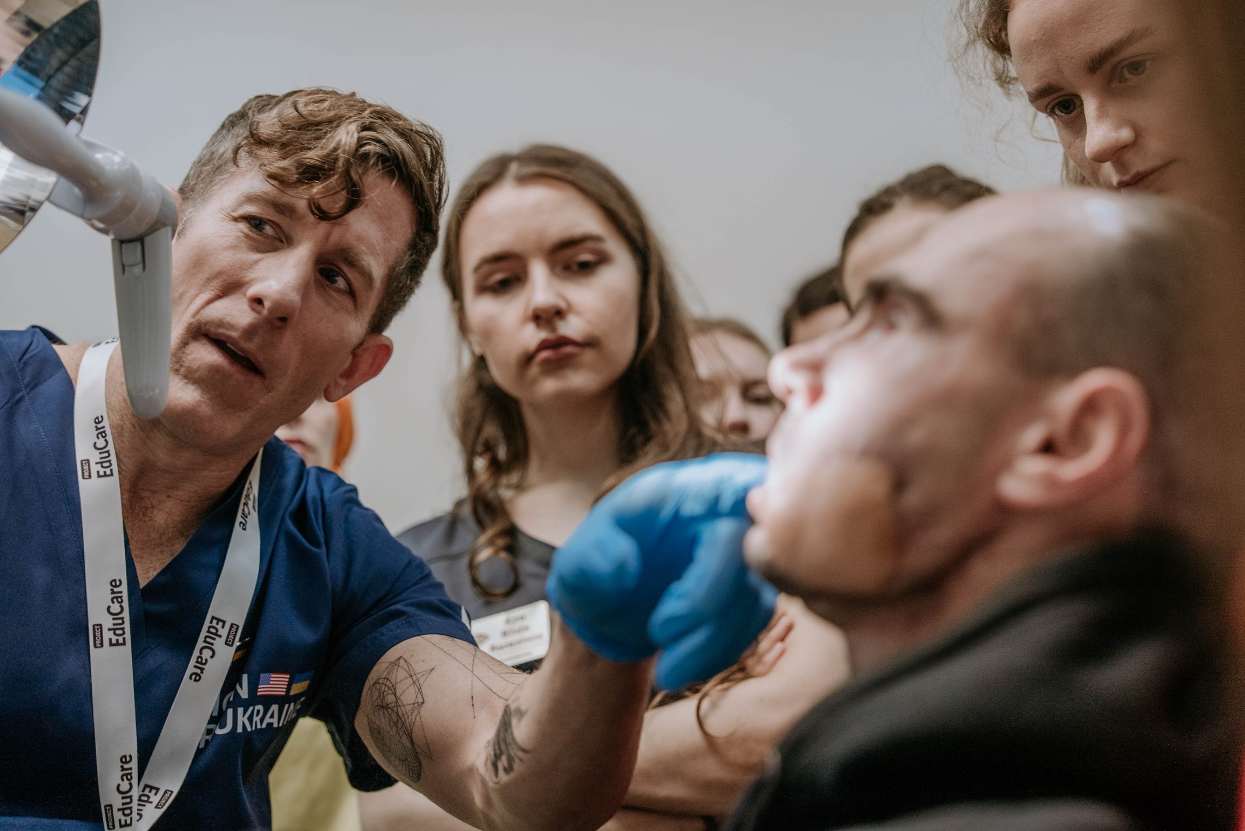 Dr. Patrick Carpenter, a surgeon with Sutter West Bay Medical Group, examines a patient as part of recent medical mission in Ukraine.