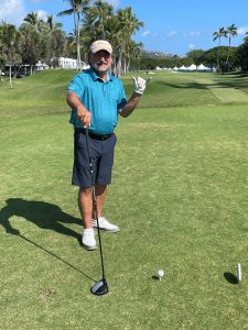Mark Benson on a golf course.