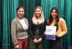 Three women with the Health Education toolkit.