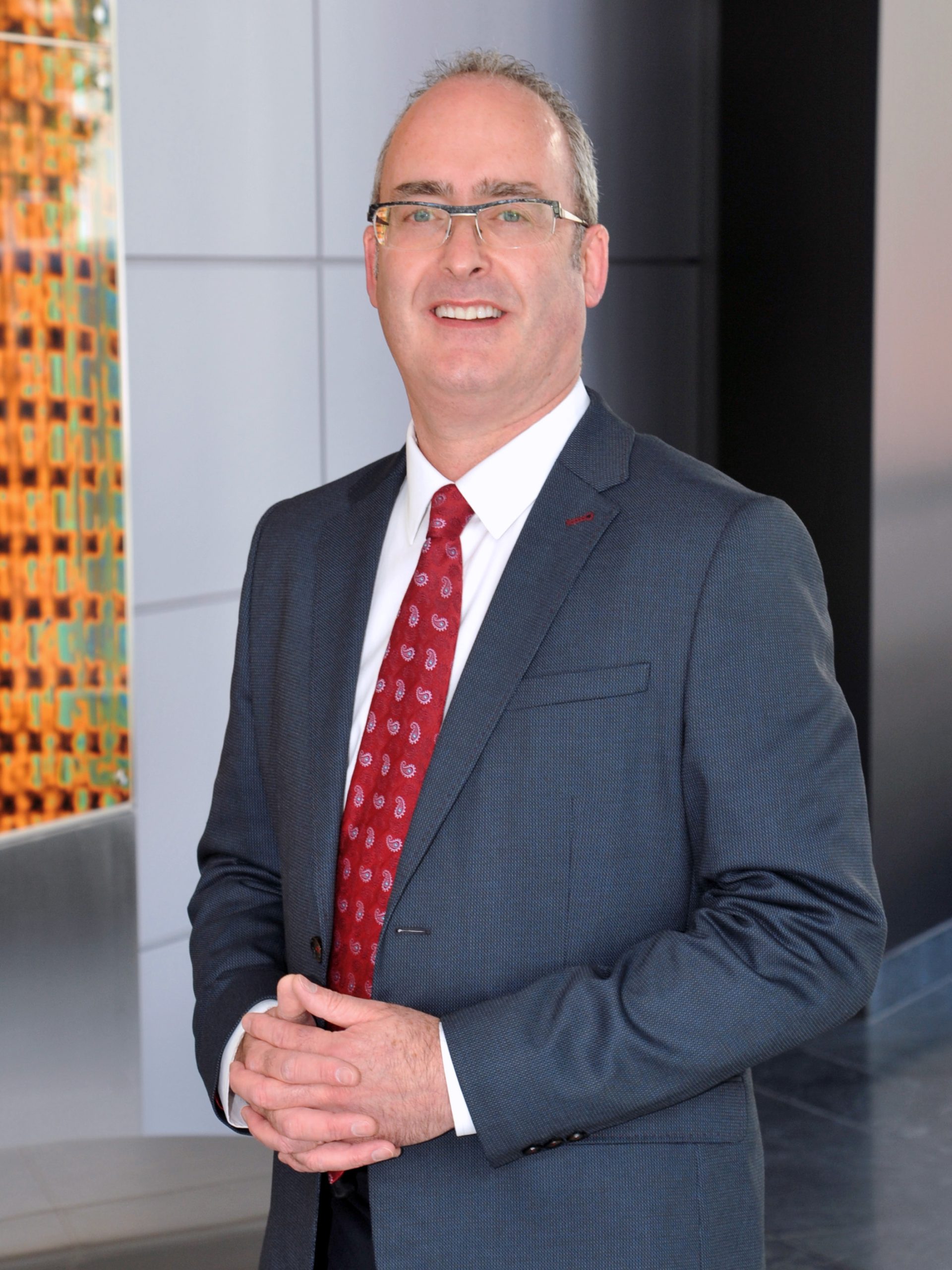 A man in a grey suit 