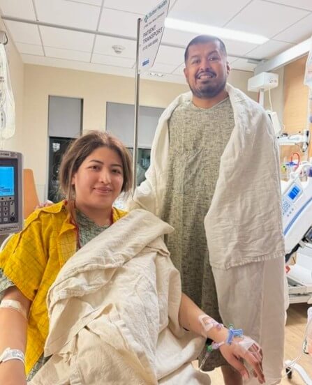 Two patients stand together