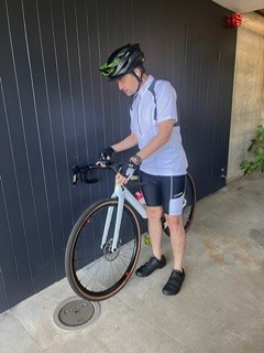 A man prepares to ride a bike