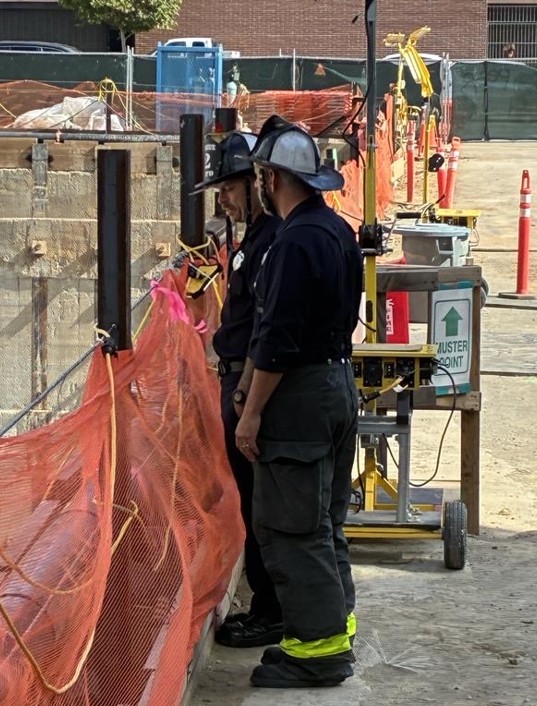 Two firefighters talking