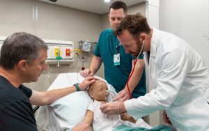 Training exercise in Sutter Health’s mobile simulation lab using a child mannequin mimicking respiratory distress.