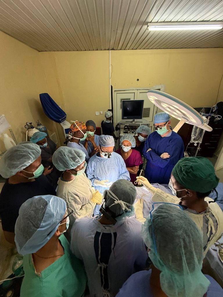 A surgeon leads a live patient training