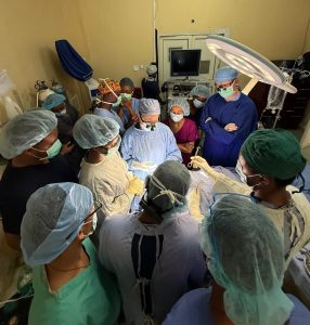 A surgeon leads a live patient training