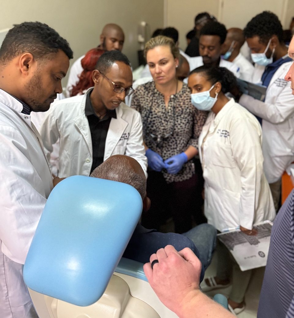 A group of physicians assess a case together