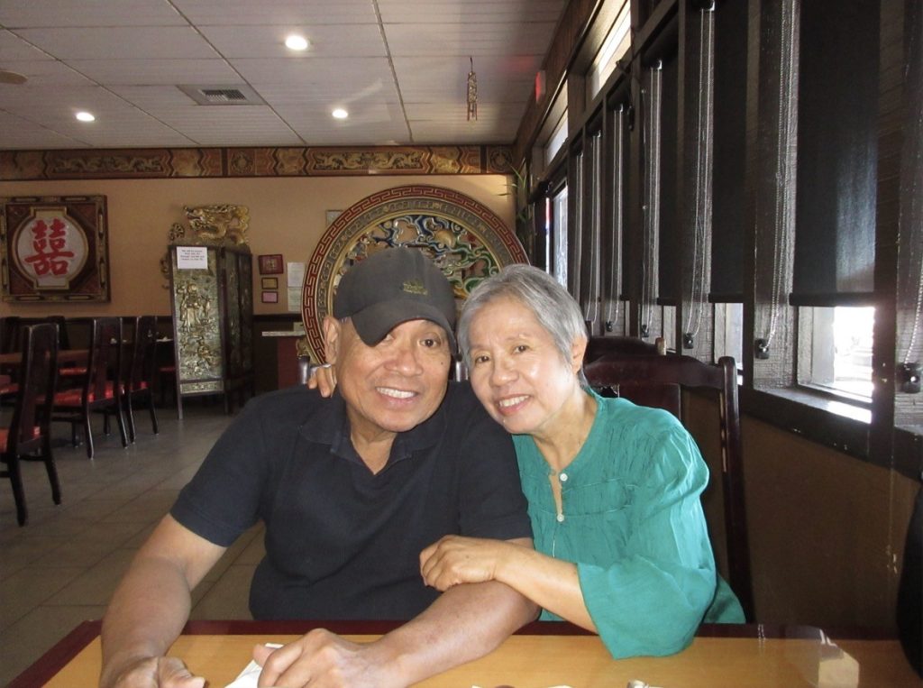 Asian couple embraces