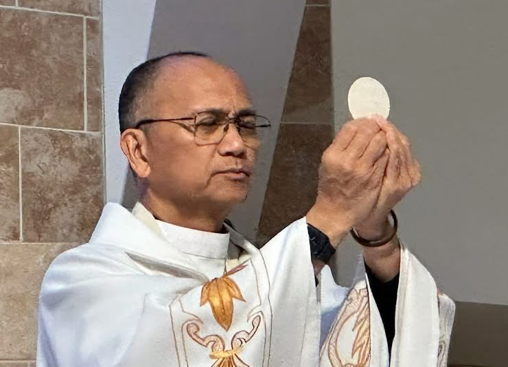 A priest performs a traditional ritual