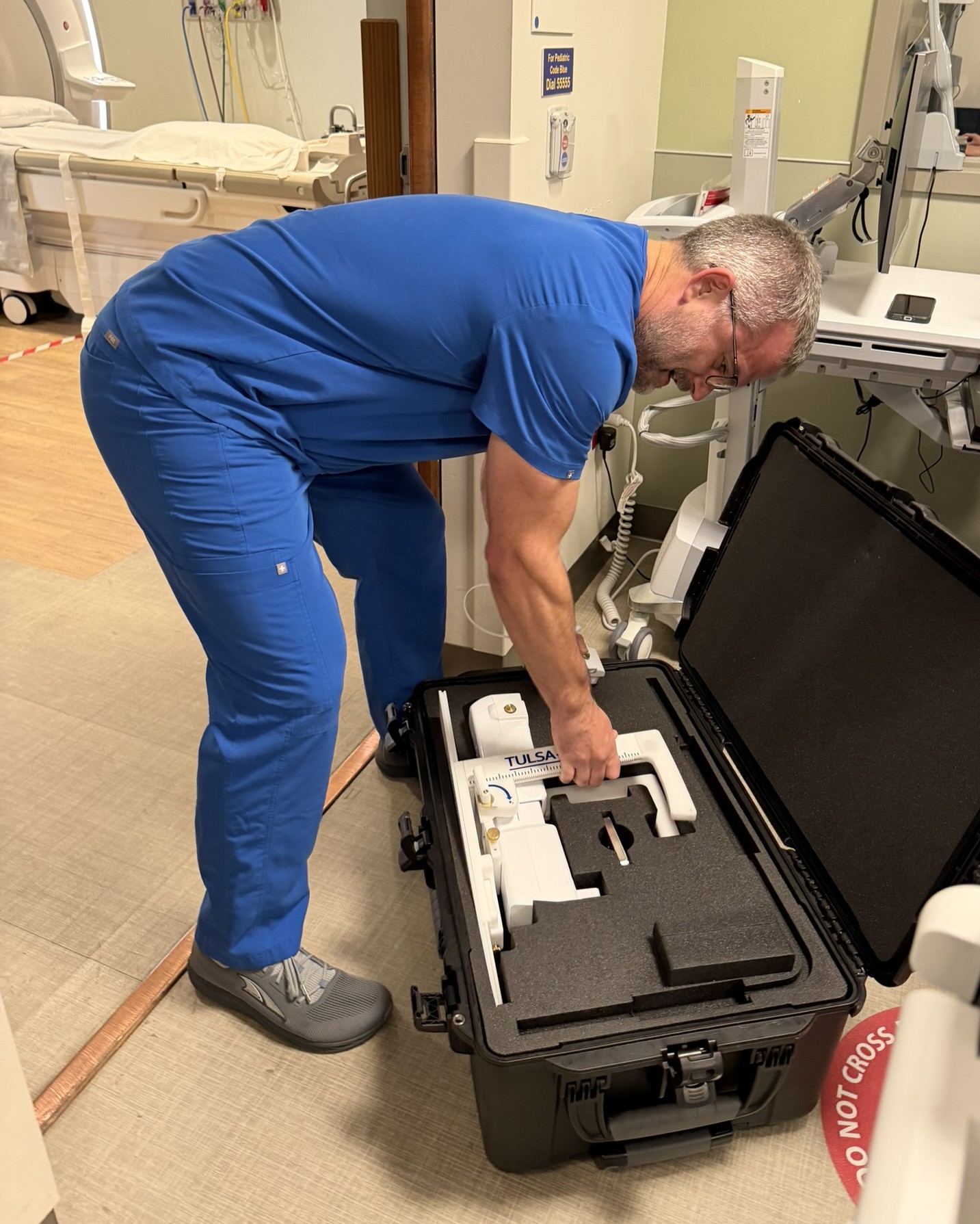 A man handles a medical device