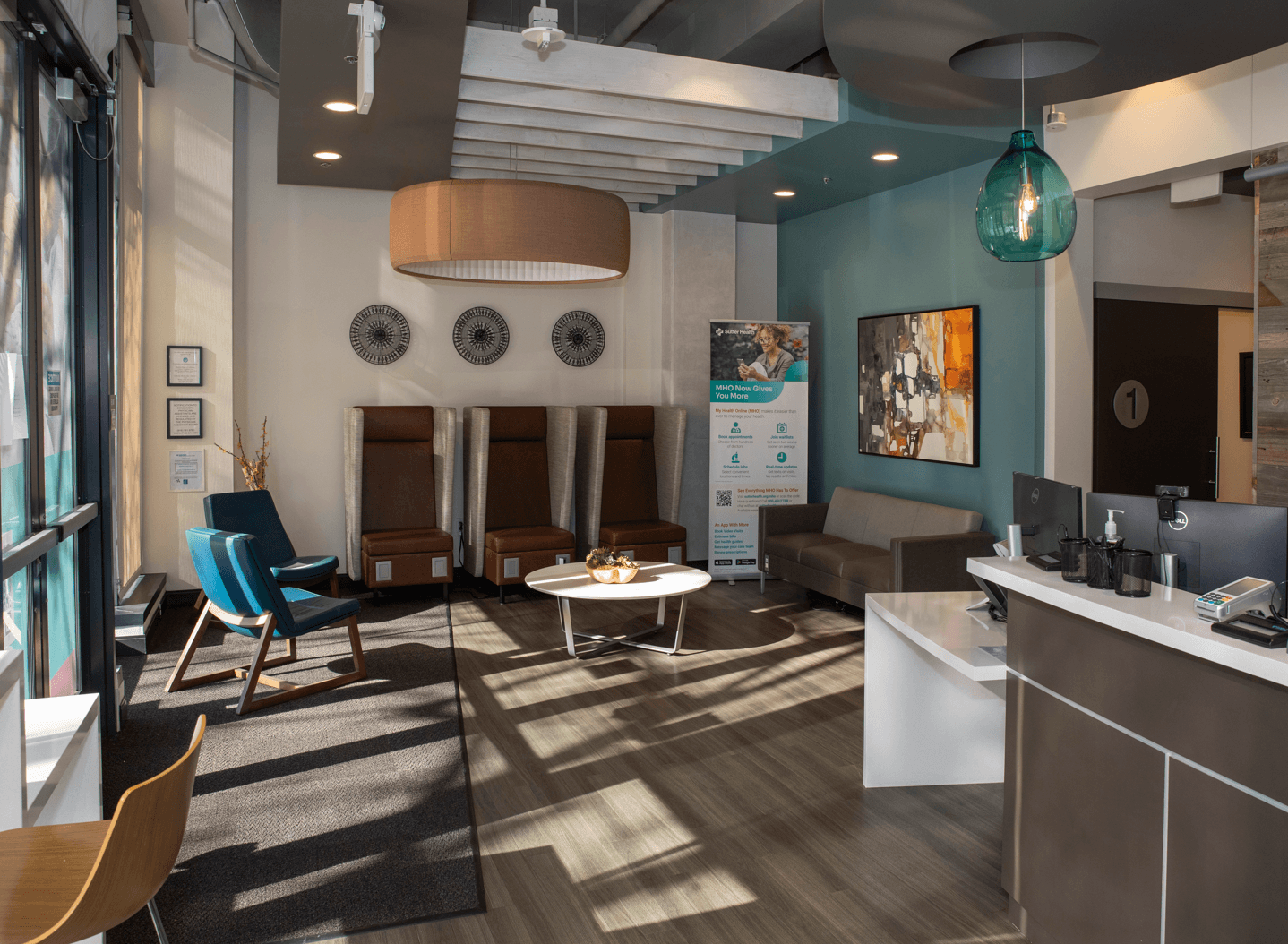 urgent care lobby with chairs and front check in desk