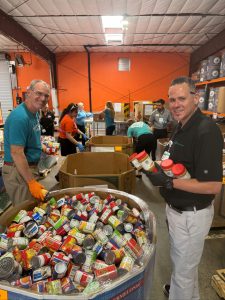Scott Knight and Matthew Reitz sorting donated food items