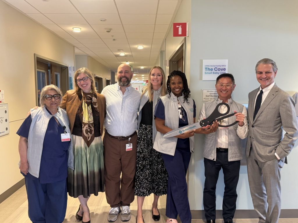 Group at a ribbon cutting in a hospital