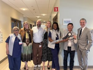 Group at a ribbon cutting in a hospital