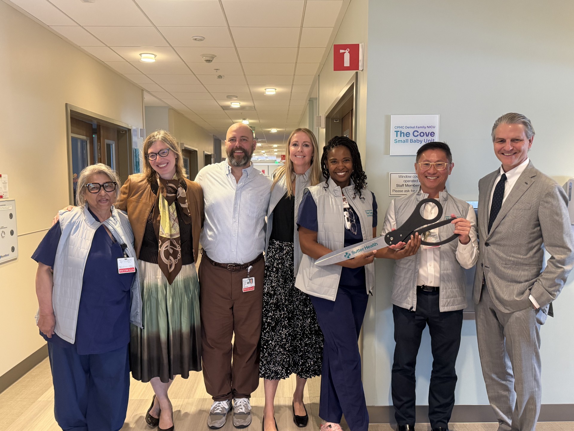 The Cove Ribbon Cutting Group at a ribbon cutting in a hospital