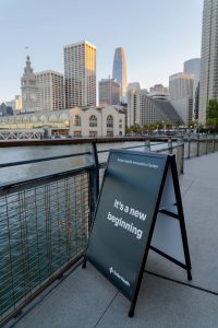Sign to Sutter's Innovation Center on Pier 1 in San Francisco with skyline behind